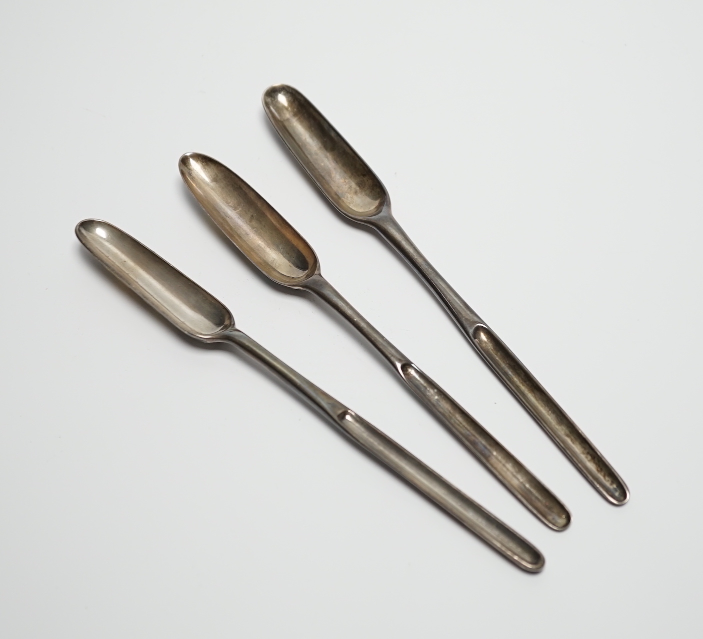 Three George II silver marrow scoops, Richard Pargeter, London, 1733, 20.7cm, Ann Hill, London, 1734 and Ebeneezer Coker?, London, 1755.